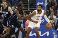 Los Angeles Clippers guard Paul George drives against Orlando Magic center Bol Bol during the first half of an NBA basketball game Wednesday, Dec. 7, 2022, in Orlando, Fla. (AP Photo/Scott Audette)