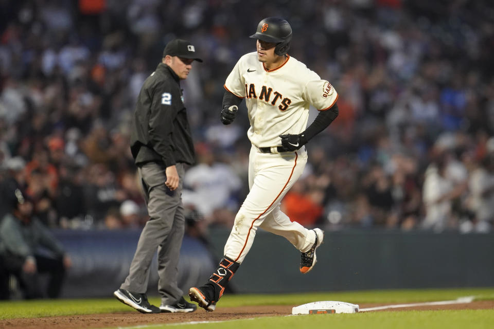 San Francisco Giants' Wilmer Flores rounds third base after hitting a home run during the fifth inning of a baseball game against the Los Angeles Dodgers in San Francisco, Monday, Aug. 1, 2022. (AP Photo/Jeff Chiu)