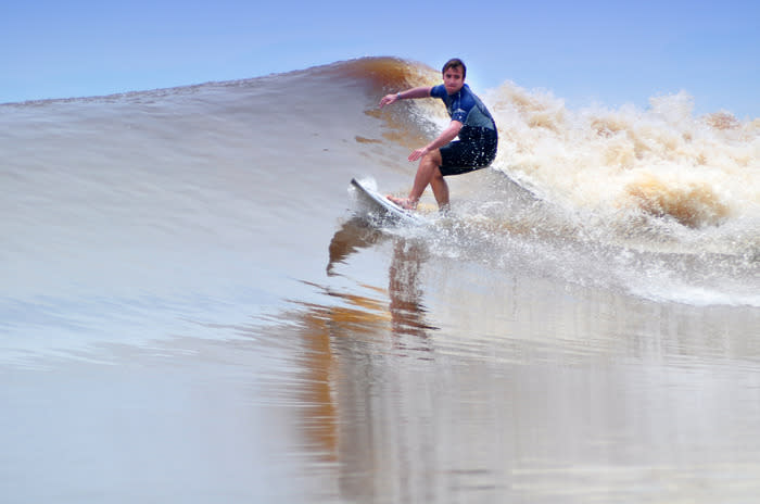 Dare devil wave riding in Kampar River, Riau