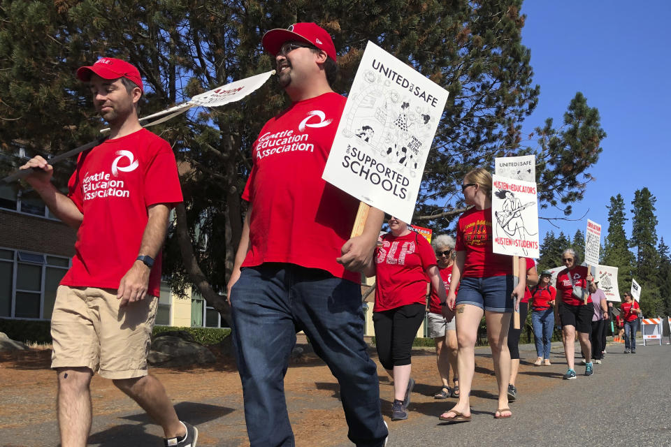 Teachers and staff from Jane Addams Middle School in north Seattle picket on what was supposed to be the first day of classes Wednesday, Sept. 7, 2022. The Seattle Education Association went on strike as the union and Seattle Public Schools failed to reach a contract agreement over issues that included pay and educational and emotional supports for students. (AP Photo/Gene Johnson)