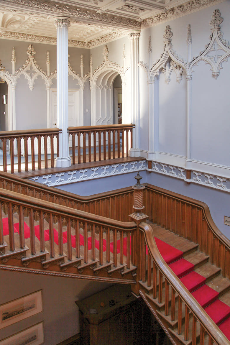 <p>Among the castle’s most striking features is this top-lit staircase and numerous doors painstakingly fashioned from carved oak. (LeadingEstates.com) </p>