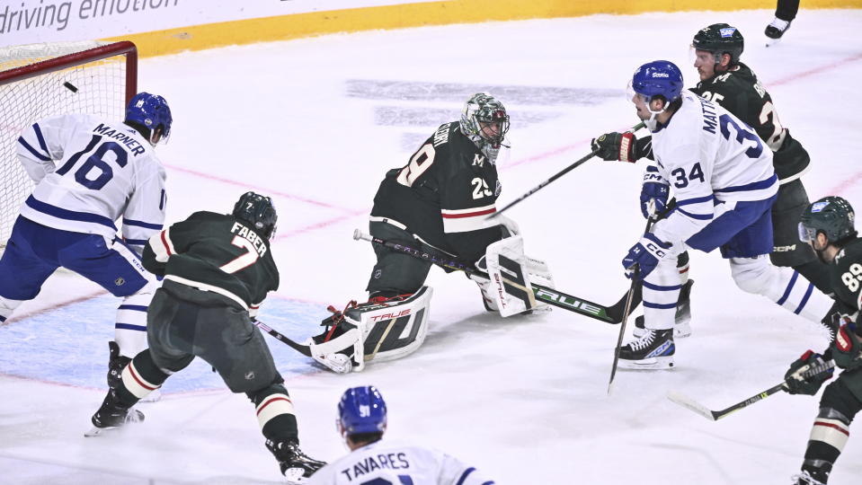 Toronto's Auston Matthews, right, scores at Minnesota's goalkeeper Marc-Andre Fleury during the NHL Global Series Sweden ice hockey match between Toronto Maple Leafs and Minnesota Wild at Avicii Arena in Stockholm, Sweden, Sunday, Nov. 19, 2023.(Claudio Bresciani/TT via AP)