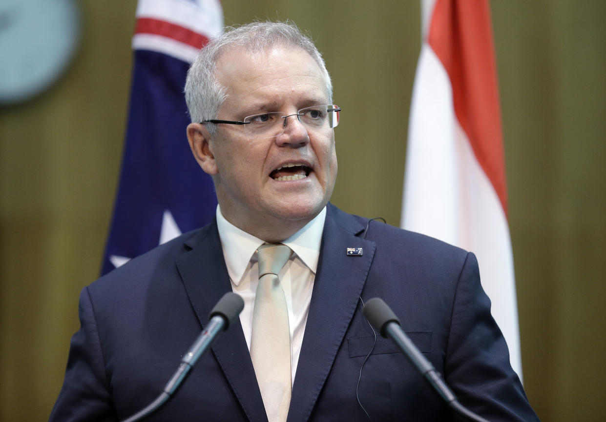 Australia's Prime Minister Scott Morrison makes a joint statement with Indonesia's President Joko Widodo at Parliament House Monday, Feb. 10, 2020. Widodo is on a two-day visit to Canberra, his fourth visit to Australia. (AP Photo/Rick Rycroft, Pool)