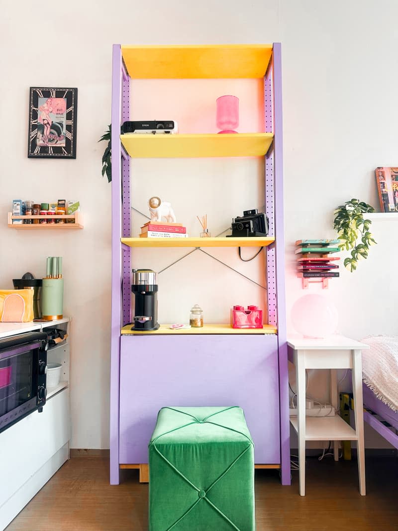 Colorful shelving in dorm room.