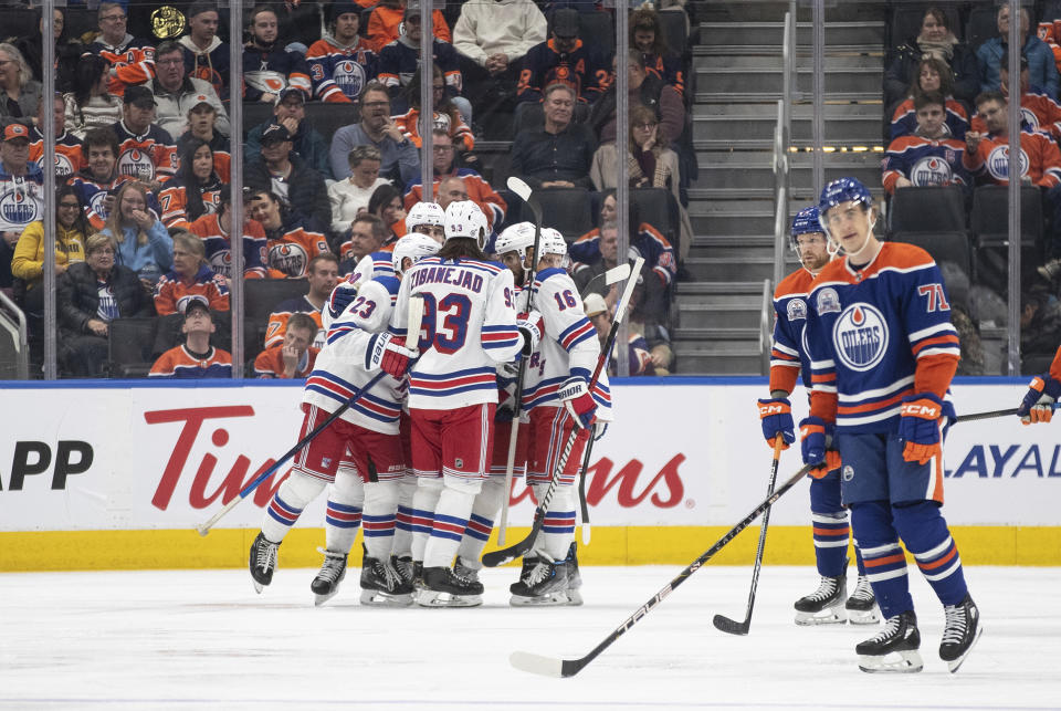 New York Rangers celebrate a goal against the Edmonton Oilers during the second period of an NHL hockey game Thursday, Oct. 26, 2023, in Edmonton, Alberta. (Jason Franson/The Canadian Press via AP)