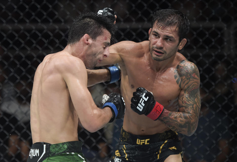 RIO DE JANEIRO, BRAZIL - MAY 04: (R-L) Alexandre Pantoja of Brazil punches Steve Erceg of Australia in a UFC flyweight championship bout during the UFC 301 event at Farmasi Arena on May 04, 2024 in Rio de Janeiro, Brazil. (Photo by Alexandre Loureiro/Zuffa LLC via Getty Images)