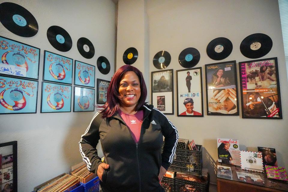 Antonia Anderson poses for a portrait in her hip-hop museum in her Milwaukee apartment. She estimates she has upward of 6,000 hip-hop pieces.