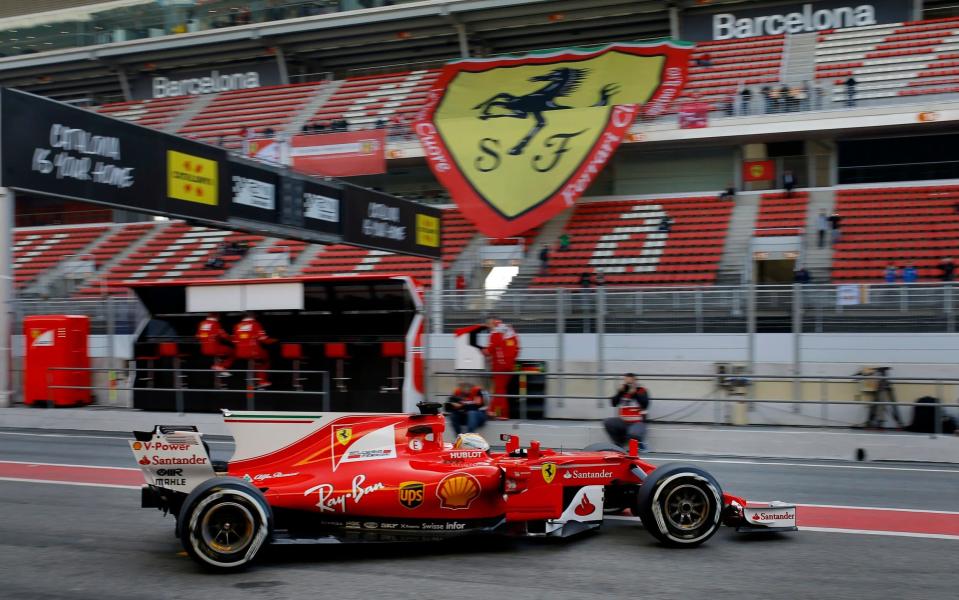 Ferrari driver Sebastian Vettel of Germany leaves the team box during a Formula One pre-season testing session at the Catalunya racetrack in Montmelo, outside Barcelona, Spain, Thursday, March 9, 2017. (AP Photo/Francisco Seco) - Credit: Francisco Seco/AP