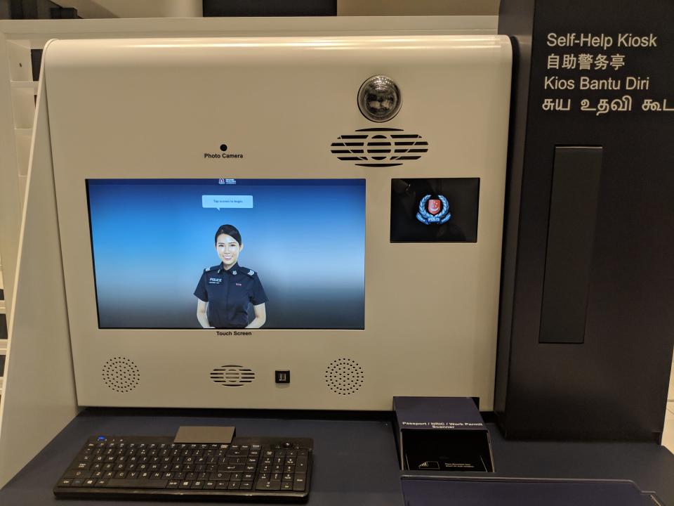 Self-help kiosks as seen at the Woodlands Police Division headquarters. (PHOTO: Yahoo News Singapore)