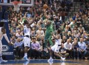 Nov 20, 2017; Dallas, TX, USA; Boston Celtics guard Kyrie Irving (11) drives to the basket past Dallas Mavericks forward Harrison Barnes (40) and guard Dennis Smith Jr. (1) during the second half at the American Airlines Center. The Celtics defeat the Mavericks 110-102. Jerome Miron-USA TODAY Sports