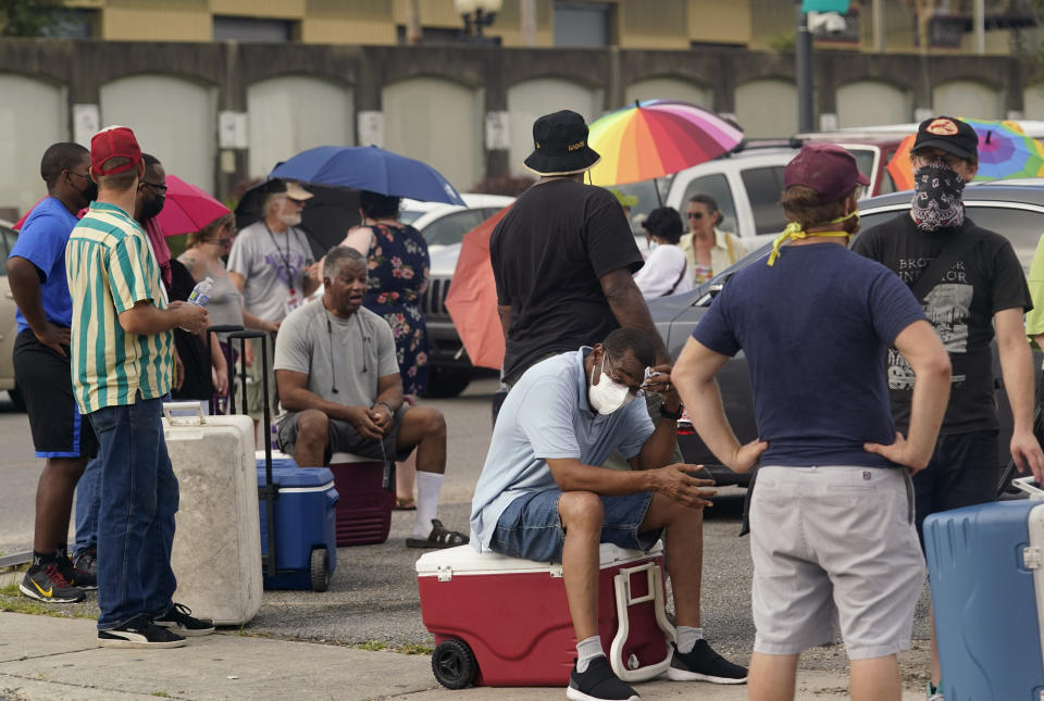 Louisiana residents still reeling from flooding and damage caused by Hurricane Ida are scrambling for food, gas, water and relief from the oppressive heat, Wednesday, Sept. 1, 2021, in New Orleans, La. (AP Photo/Eric Gay)