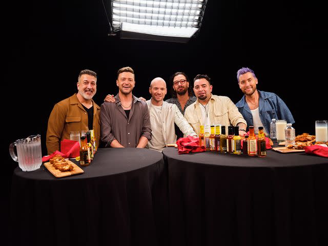 <p>First We Feast</p> *NSYNC members with Sean Evans on Hot Ones