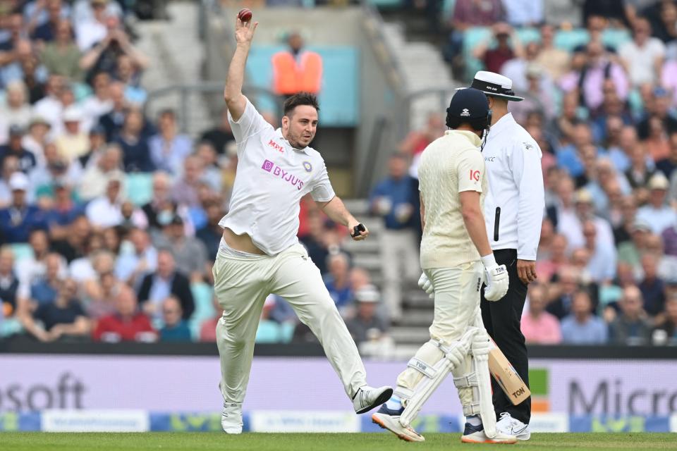 Pitch invader Jarvo pretends to bowl as he delays play on the second day of the fourth cricket Test match between England and India at the Oval cricket ground in London on September 3, 2021.