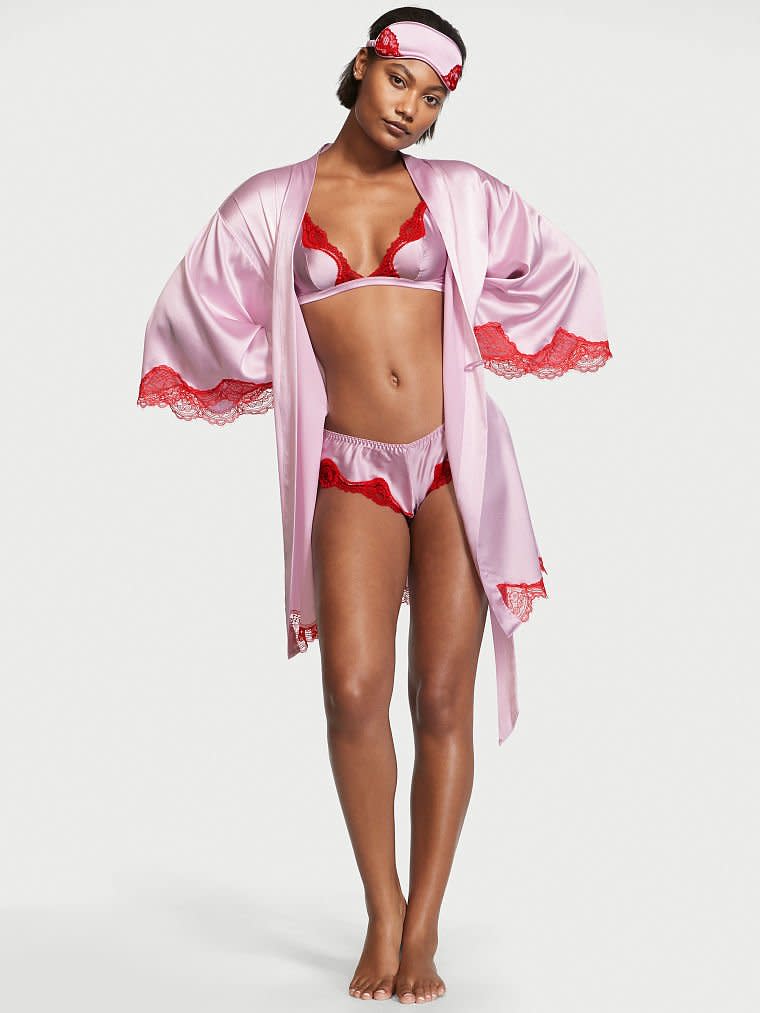 <p>"If there's anything more luxurious than a silky pair of pajamas, it's a silk lingerie set complete with a matching robe. This four-piece gift from Victoria's Secret is the ultimate package. Not only does it consist of a wireless unlined plunge bralette, cheeky panty, and robe, but it also includes a matching eye mask with lace trim. Now that's how you bring glamour to bed." — <em>Julia Guerra, Freelance Fashion Writer</em></p>