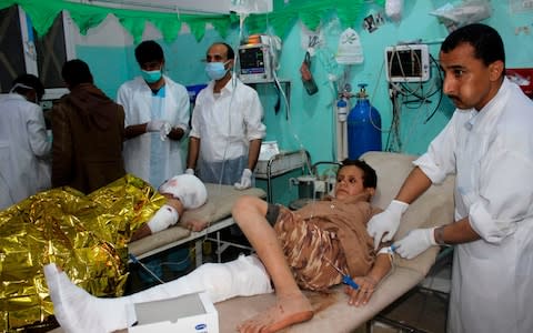 An injured Yemeni child receives medical aid at an emergency room in the Saada province early on November 20, 2018, following a reported air strike - Credit: AFP