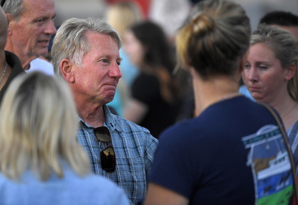 Glen Fritzler, left, co-owner of Truth Aquatics and the dive boat Conception, is seen during a vigil Friday, Sept. 6, 2019, in Santa Barbara, Calif., for the victims who died aboard the dive boat Conception. The Sept. 2 fire took the lives of 34 people on the ship off Santa Cruz Island off the Southern California coast near Santa Barbara. (AP Photo/Mark J. Terrill)