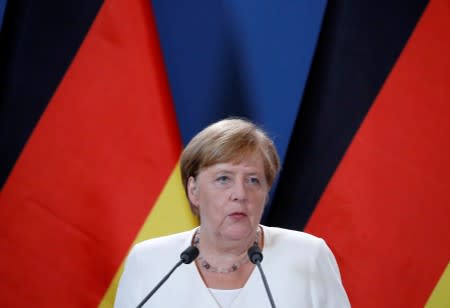 FILE PHOTO: German Chancellor Merkel and Hungarian PM Orban hold a news conference in Sopron