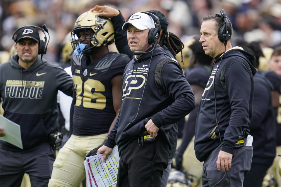 Purdue head coach Jeff Brohm watches from the sideline during the first half of an NCAA college football game against Wisconsin in West Lafayette, Ind., Saturday, Oct. 23, 2021. (AP Photo/Michael Conroy)