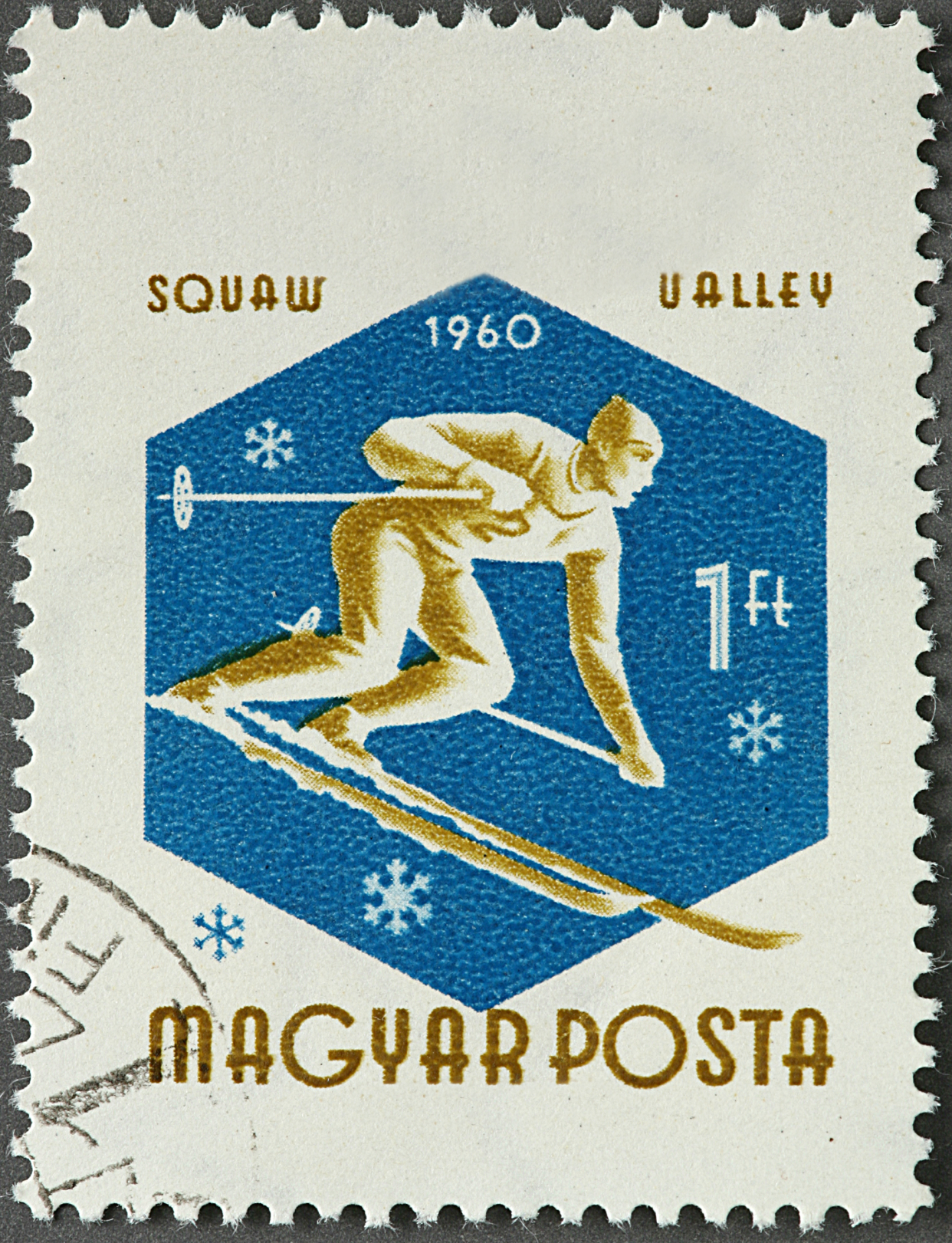 Postage Stamp with a vintage skier scene, Squaw Valley, Magyar Posta, Hungary, tan skier on blue on a white background