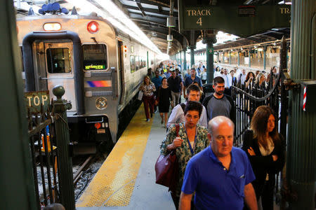 People arrive to the Hoboken Terminal in New Jersey to commute to New York City, U.S., July 10, 2017. REUTERS/Eduardo Munoz