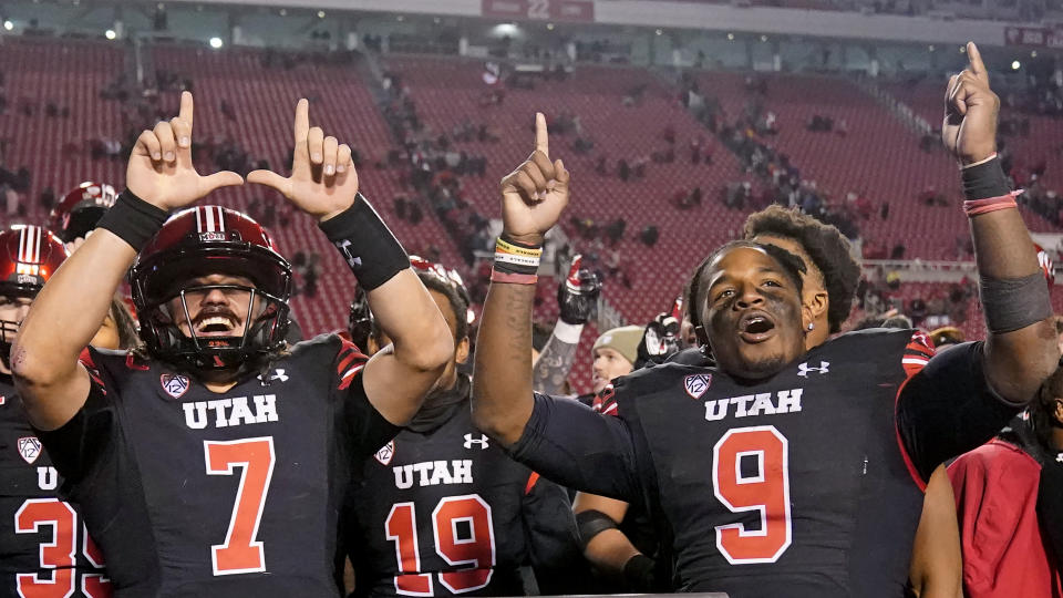 Utah's quarterback Cameron Rising (7) and running back Tavion Thomas (9) celebrate after their NCAA college football game against Stanford Saturday, Nov. 12, 2022, in Salt Lake City. (AP Photo/Rick Bowmer)