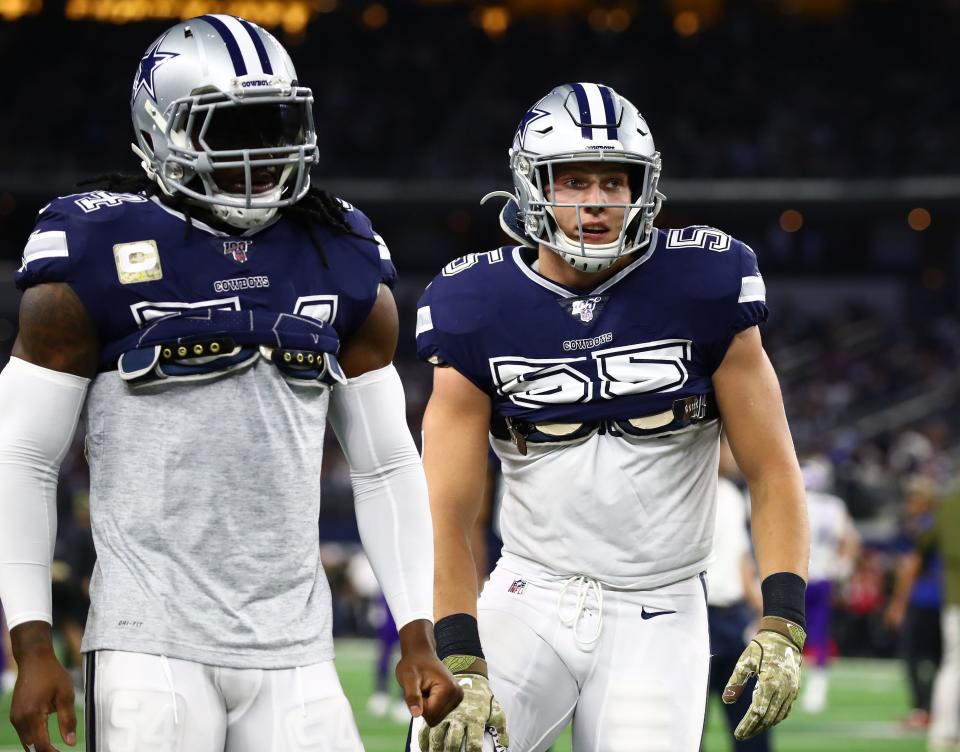 Dallas Cowboys linebacker Leighton Vander Esch (55) and Jaylon Smith (54) prior to the game against the Minnesota Vikings at AT&T Stadium.