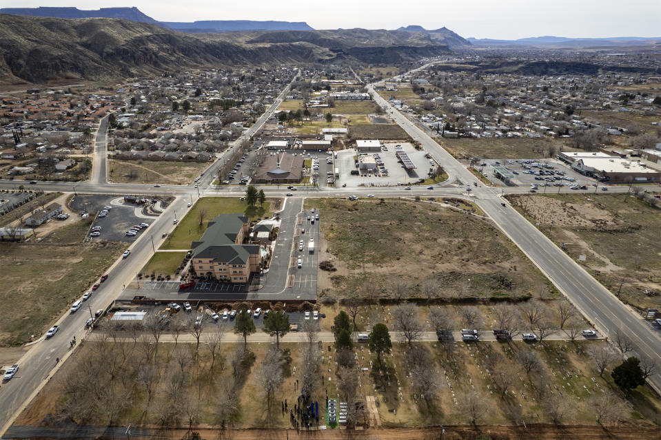 In this image taken with a drone, the graveside service for the Earl-Haight funeral is held at the Cemetery in La Verkin on Friday, Jan. 13, 2023, in La Verkin, Utah. Tausha Haight, her mother, Gail Earl, and her five children were shot and killed by her husband Jan. 4. (Rick Egan/The Salt Lake Tribune via AP)