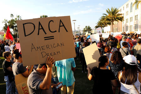 FILE PHOTO: Alliance San Diego and other Pro-DACA supporters hold a protest rally, following U.S. President Donald Trump's DACA announcement, in front of San Diego County Administration Center in San Diego, California, U.S., September 5, 2017. REUTERS/John Gastaldo/File Photo