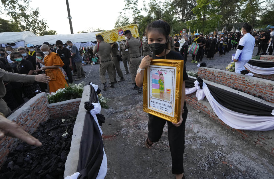 Funeral pyres are prepared for victims in the day care center attack at Wat Rat Samakee temple in Uthai Sawan, northeastern Thailand, Tuesday, Oct. 11, 2022. A former police officer burst into a day care center in northeastern Thailand on Thursday, killing dozens of preschoolers and teachers before shooting more people as he fled. (AP Photo/Sakchai Lalit)