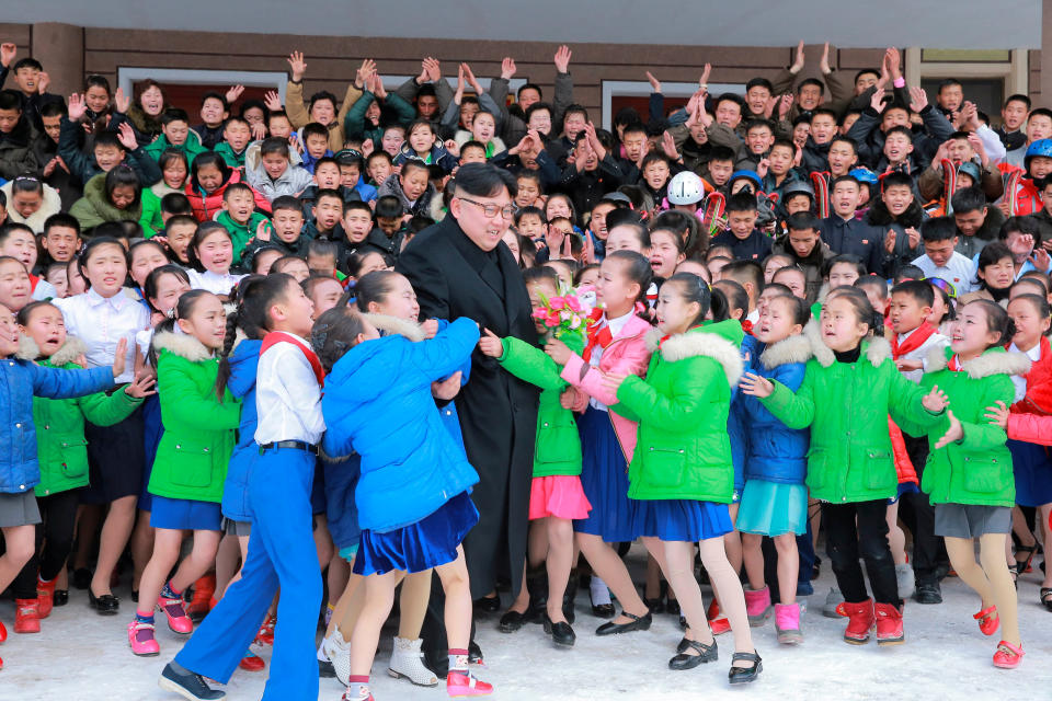 North Korean leader Kim Jong Un is hugged by children during his visit to Samjiyon County in this undated photo released by North Korea's Korean Central News Agency (KCNA) in Pyongyang November 28, 2016. REUTERS/KCNA   ATTENTION EDITORS - THIS IMAGE WAS PROVIDED BY A THIRD PARTY. EDITORIAL USE ONLY. REUTERS IS UNABLE TO INDEPENDENTLY VERIFY THIS IMAGE. NO THIRD PARTY SALES. NOT FOR USE BY REUTERS THIRD PARTY DISTRIBUTORS. SOUTH KOREA OUT. NO COMMERCIAL OR EDITORIAL SALES IN SOUTH KOREA.       TPX IMAGES OF THE DAY