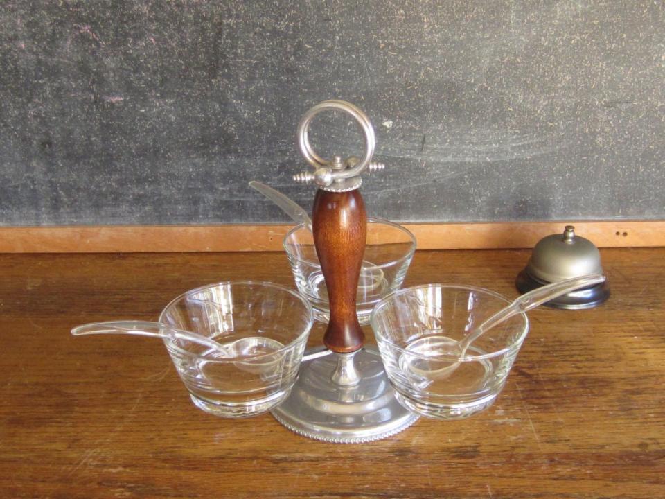 <p>It was all about presentation in the good ol' days. Case in point: This cute <a href="https://www.etsy.com/listing/169589641/condiment-serving-tray-with-3-bowls-and" rel="nofollow noopener" target="_blank" data-ylk="slk:condiment serving tray;elm:context_link;itc:0;sec:content-canvas" class="link ">condiment serving tray</a> from the '60s with glass bowls and ladles.</p>