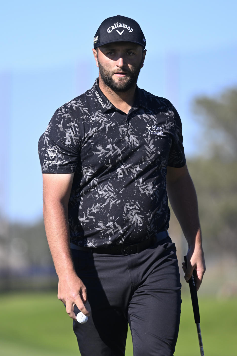 Jon Rahm, of Spain, walks off the course after finishing his round on the tenth hole of the North Course during the second round of the Farmers Insurance Open golf tournament, Thursday Jan. 27, 2022, in San Diego. (AP Photo/Denis Poroy)