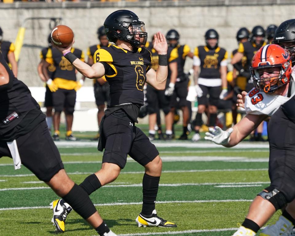 Adrian College's Mark Lopez looks to pass during Saturday's game against Hope.