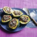 <p>Squash makes for the perfect vessel for sweet and tart cranberries, sausage, and herbs.</p><p><strong><a href="https://www.womansday.com/food-recipes/food-drinks/a29430395/sausage-and-sage-stuffed-acorn-squash-recipe/" rel="nofollow noopener" target="_blank" data-ylk="slk:Get the recipe.;elm:context_link;itc:0;sec:content-canvas" class="link ">Get the recipe.</a></strong></p>