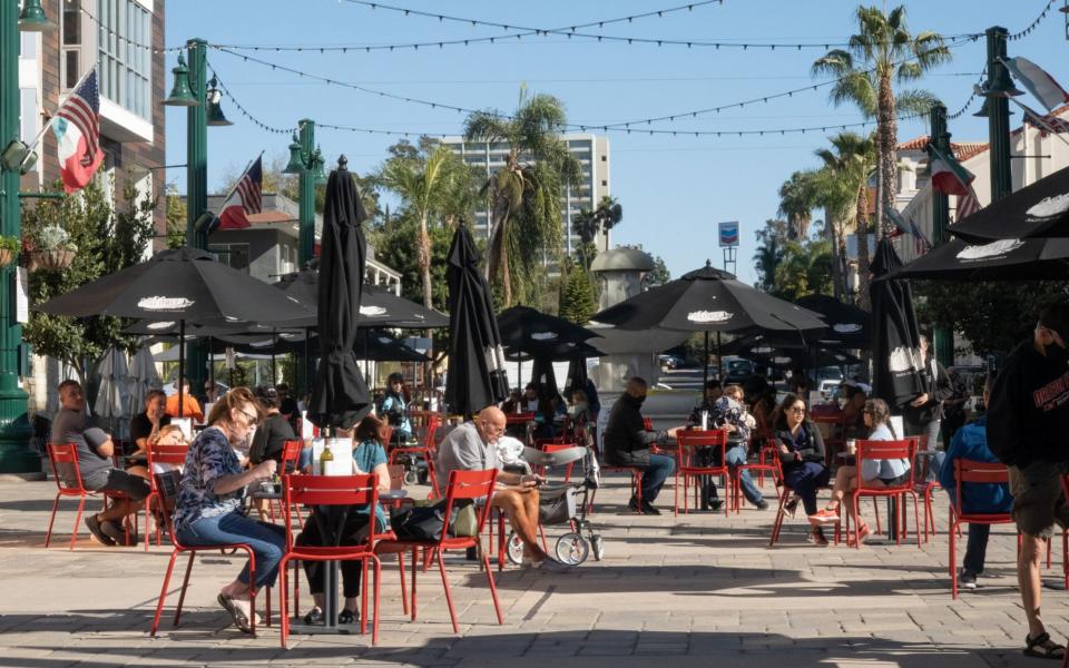 People dine outside in the Little Italy neighborhood of San Diego, California, January 2021  - Bing Guan /Bloomberg