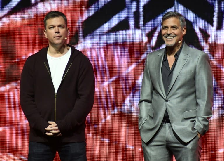 Actors Matt Damon (L) and George Clooney speak onstage at CinemaCon 2017 Paramount Pictures Presentation, at Caesars Palace in Las Vegas, Nevada, on March 28