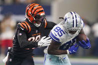Dallas Cowboys wide receiver Noah Brown (85) makes a catch as Cincinnati Bengals cornerback Eli Apple (20) makes the tackle during the first half of an NFL football game Sunday, Sept. 18, 2022, in Arlington, Tx. (AP Photo/Tony Gutierrez)