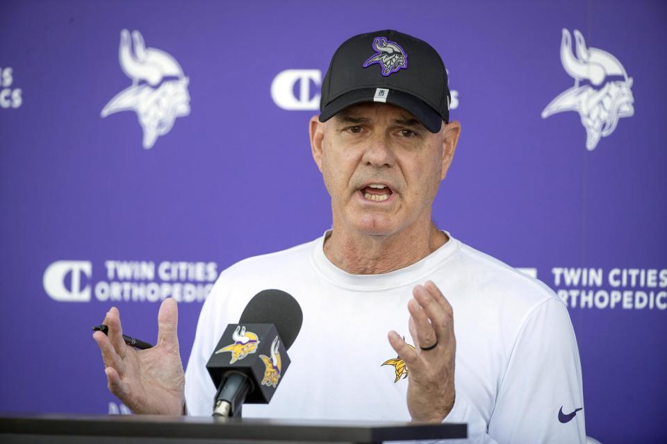 FILE -Minnesota Vikings defensive coordinator Ed Donatell speaks to the media before his team takes part in joint drills with the San Francisco 49ers at the Vikings NFL football team's practice facility in Eagan, Minn., Wednesday, Aug. 17, 2022. The Minnesota Vikings are taking a hard look at their defensive scheme on a shortened week of preparation after a failure to pressure the quarterback and stop long passes into their zone coverage at Detroit resulted in a franchise-record fifth straight game of 400-plus yards allowed. (AP Photo/Bruce Kluckhohn, File)