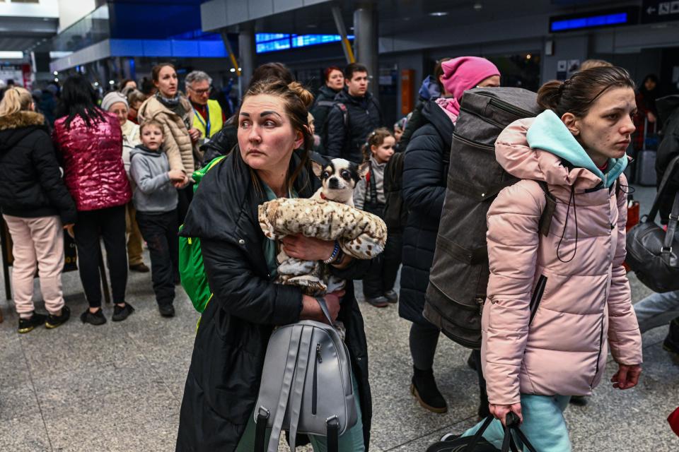 People who fled the war in Ukraine walk towards a humanitarian train to relocate refugees to Berlin on March 13., 2022 in Krakow, Poland (Getty Images)