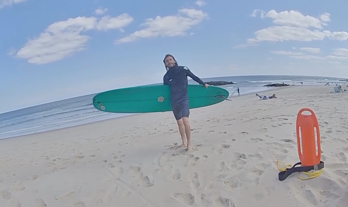 Liam Mahoney was surfing near Belmar’s 19th avenue on August 20 when he was confronted by police about his lack of beach badge (Belmar Police Department/Facebook)