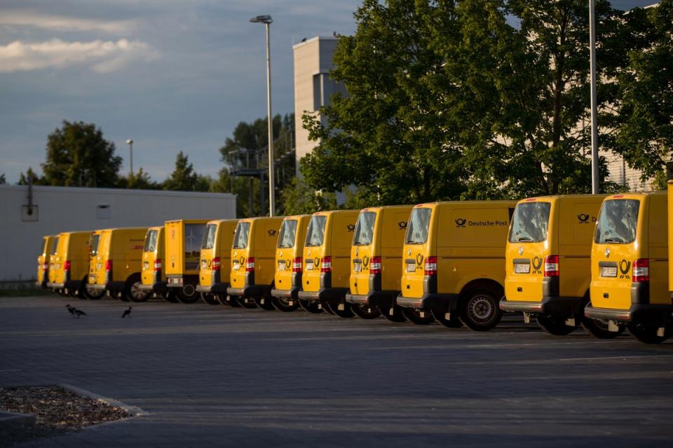 Electric delivery vans parked outside a Deutsche Post AG sorting office in Berlin (Bloomberg via Getty Images)