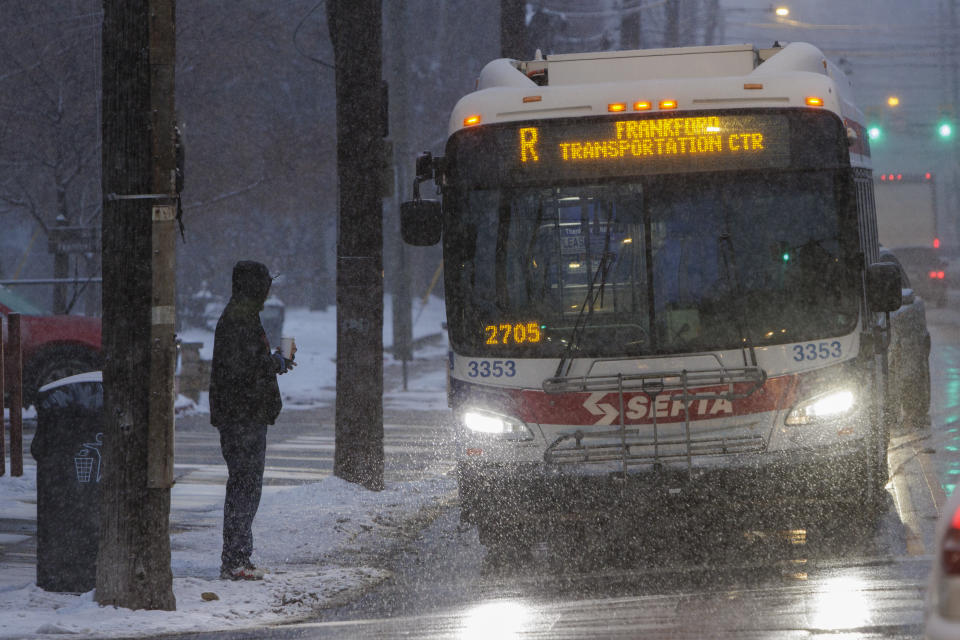 A commuter catches the SEPTA R bus at Ridge Avenue and Midvale in the East Falls section of Philadelphia on Friday, Jan. 19, 2024. Philadelphia and region is preparing for snow. (Alejandro A. Alvarez/The Philadelphia Inquirer via AP)