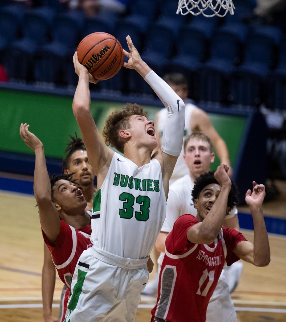 North's Cameron Gehlhausen (33) is fouled going for the offensive rebound during the United Fidelity Bank River City Showcase game between the North Huskies and the Jeffersonville Red Devils at the Screaming Eagles Arena in Evansville, Ind., Friday evening, Dec. 3, 2021.