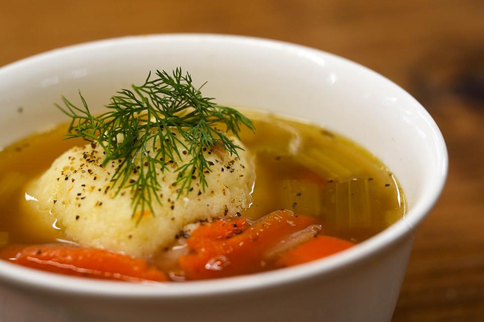 A bowl of Matzo ball soup is served at Mum Foods Smokehouse And Delicatessen on Sunday, Dec. 17, 2023 in Austin.