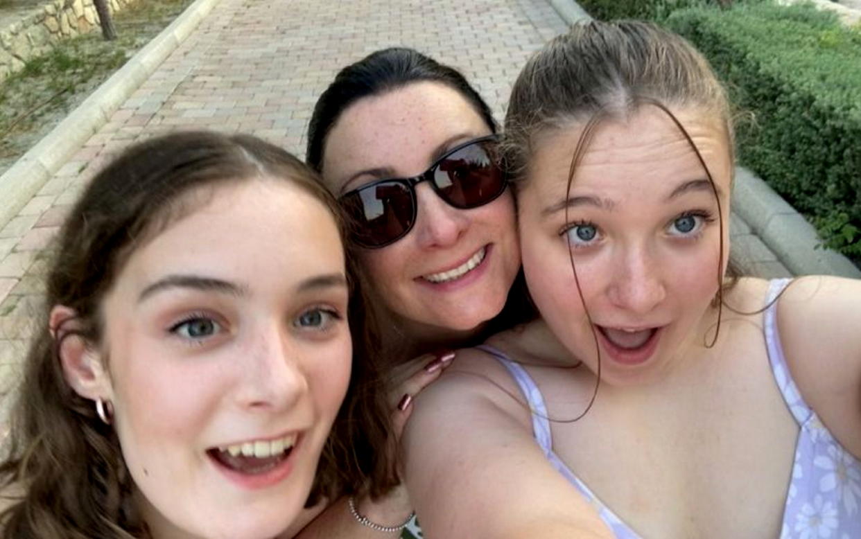 Danielle Faulkner, 44, with daughters Amelie, 15, and Isobel, 17, on holiday in Greece before the illness. (swns)