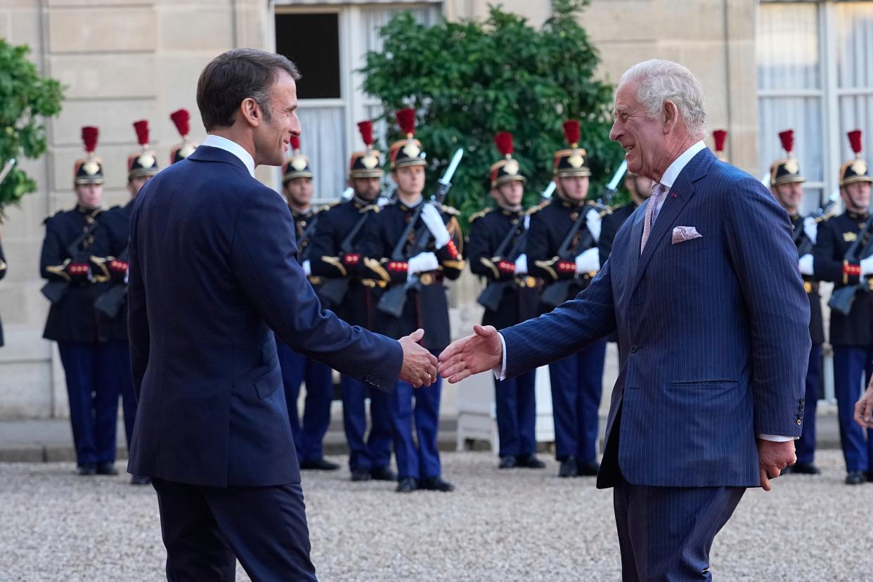 Britain's King Charles III shakes hands with French President Emmanuel Macron before they bade each other farewell (AP)