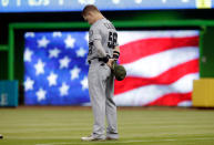 <p>Los Angeles Angels right-fielder Kole Calhoun stands for the national anthem before an interleague baseball game against the Miami Marlins on May 27, 2017, in Miami. The players wore camouflage colors to commemorate Memorial Day. (Photo: Lynne Sladky/AP) </p>