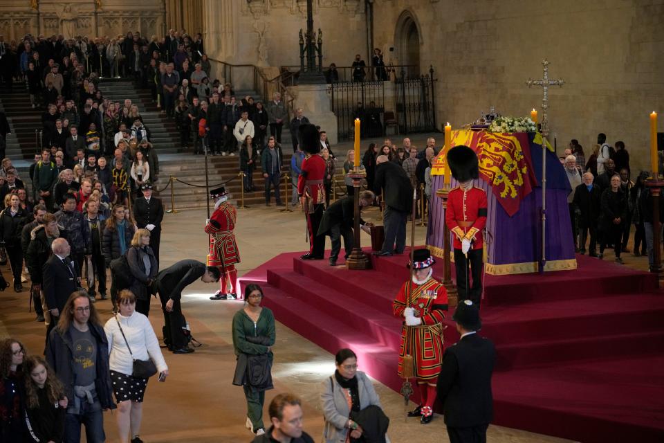 Members of the public file past the coffin of Queen Elizabeth II on Sunday, who is lying in state in Westminster Hall in London.