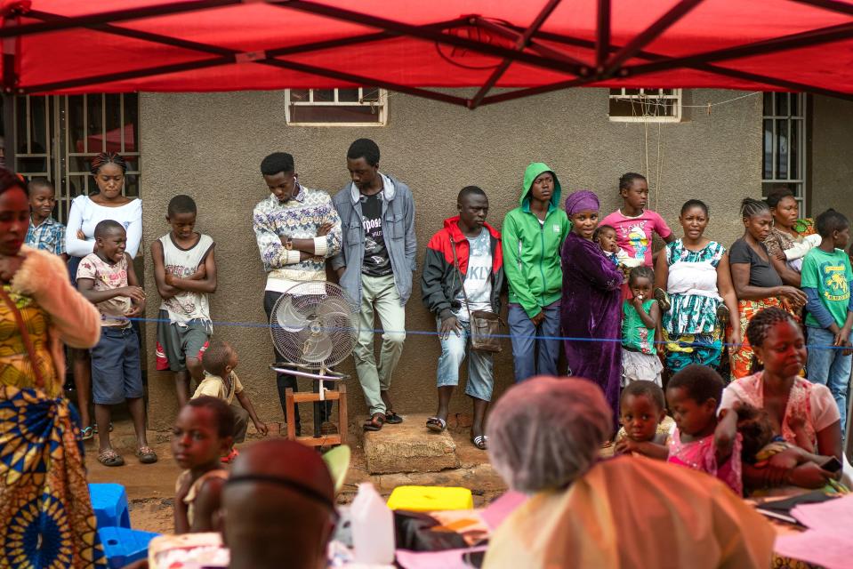 People line up to receive the vaccine for Ebola in Beni, Congo, on  July 13, 2019.