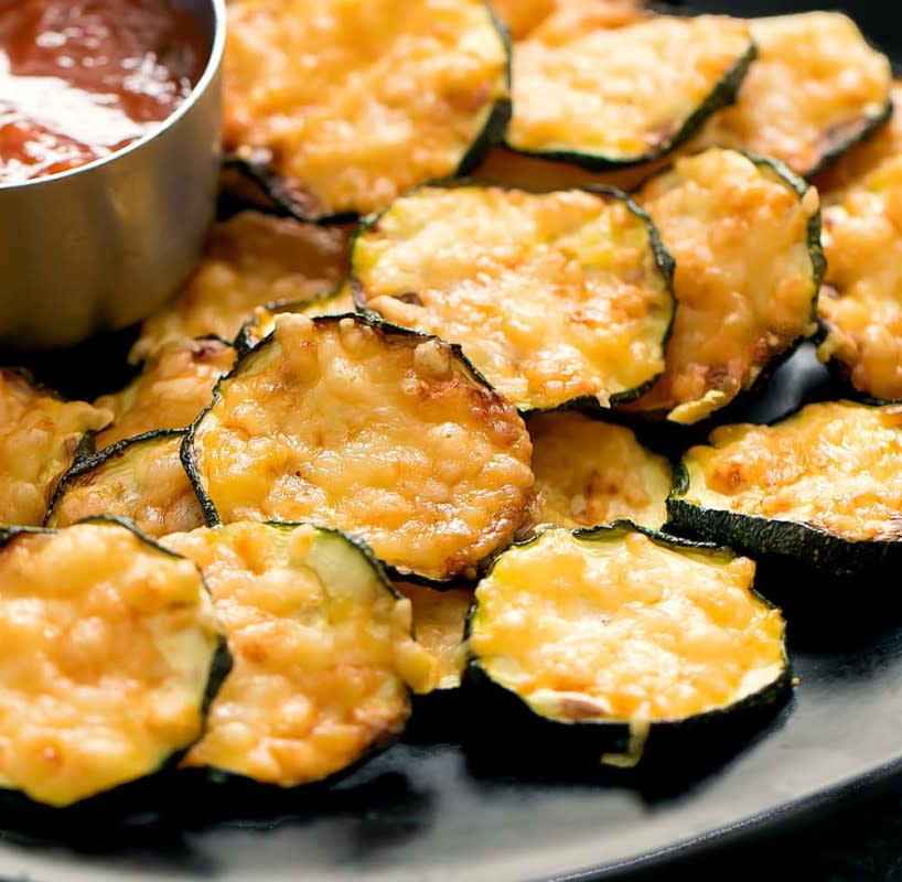 <p>Kirbie Cravings</p><p>These two-ingredient parmesan zucchini crisps couldn’t be any easier. They are crispy and flavorful and make a great snack or side dish.</p><p><strong>Get the recipe: <a href="https://kirbiecravings.com/parmesan-zucchini-crisps-2/" rel="nofollow noopener" target="_blank" data-ylk="slk:Parmesan Zucchini Crisps;elm:context_link;itc:0;sec:content-canvas" class="link ">Parmesan Zucchini Crisps</a></strong></p>